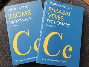 Cover images of the COBUILD Idioms Dictioary fourt edition and the COBUILD Phrasal Verbs Dictionary fourth edition